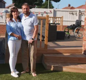 Jason Burn and his wife, on the new lawn
